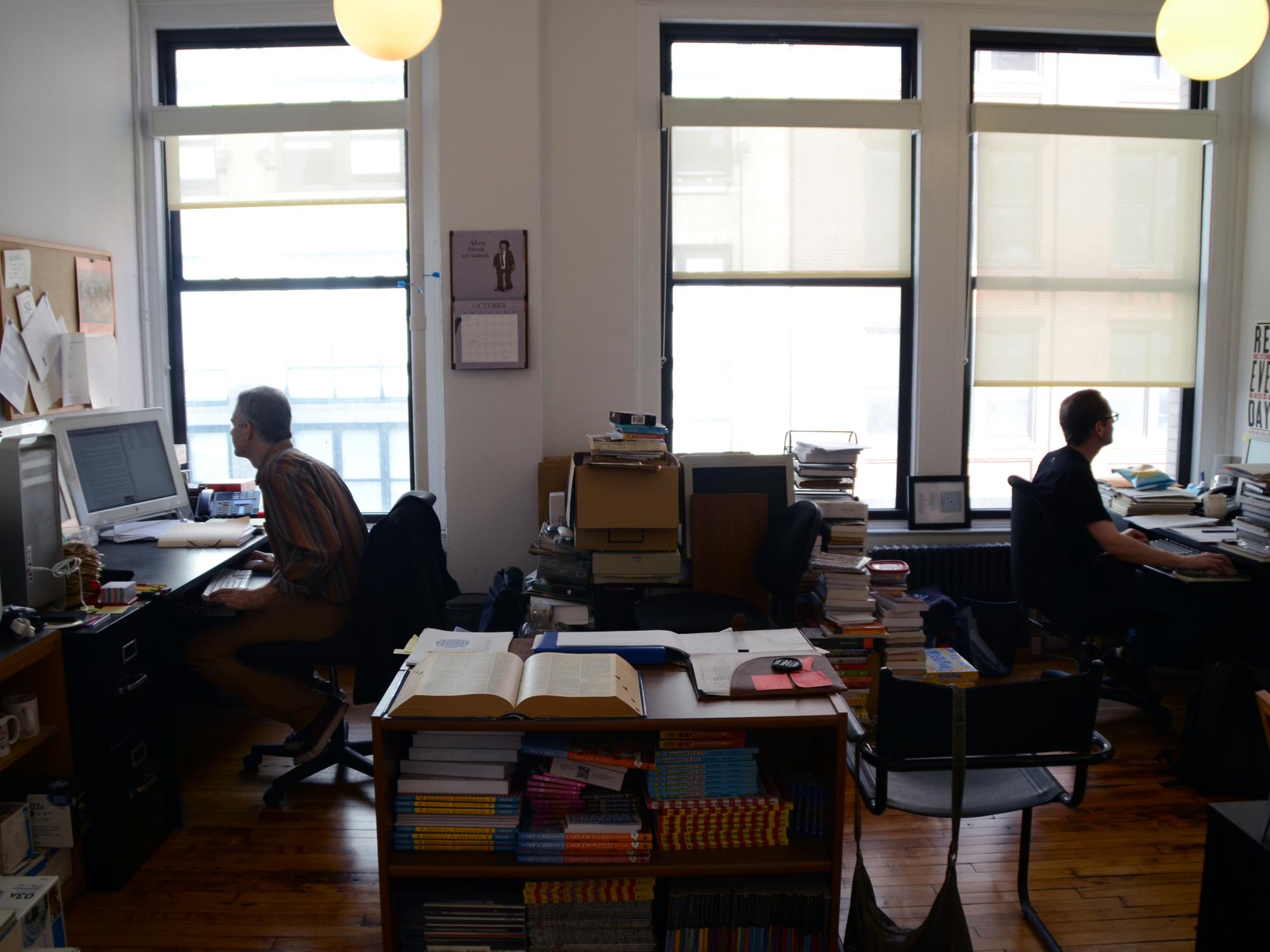 Shenk and his partner working in office