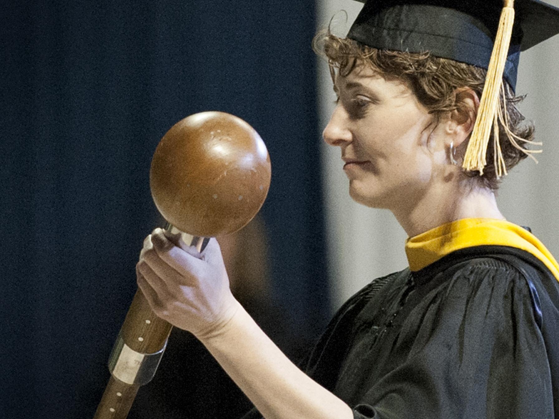 Lori Gravish carrying mace at 2013 spring commencement