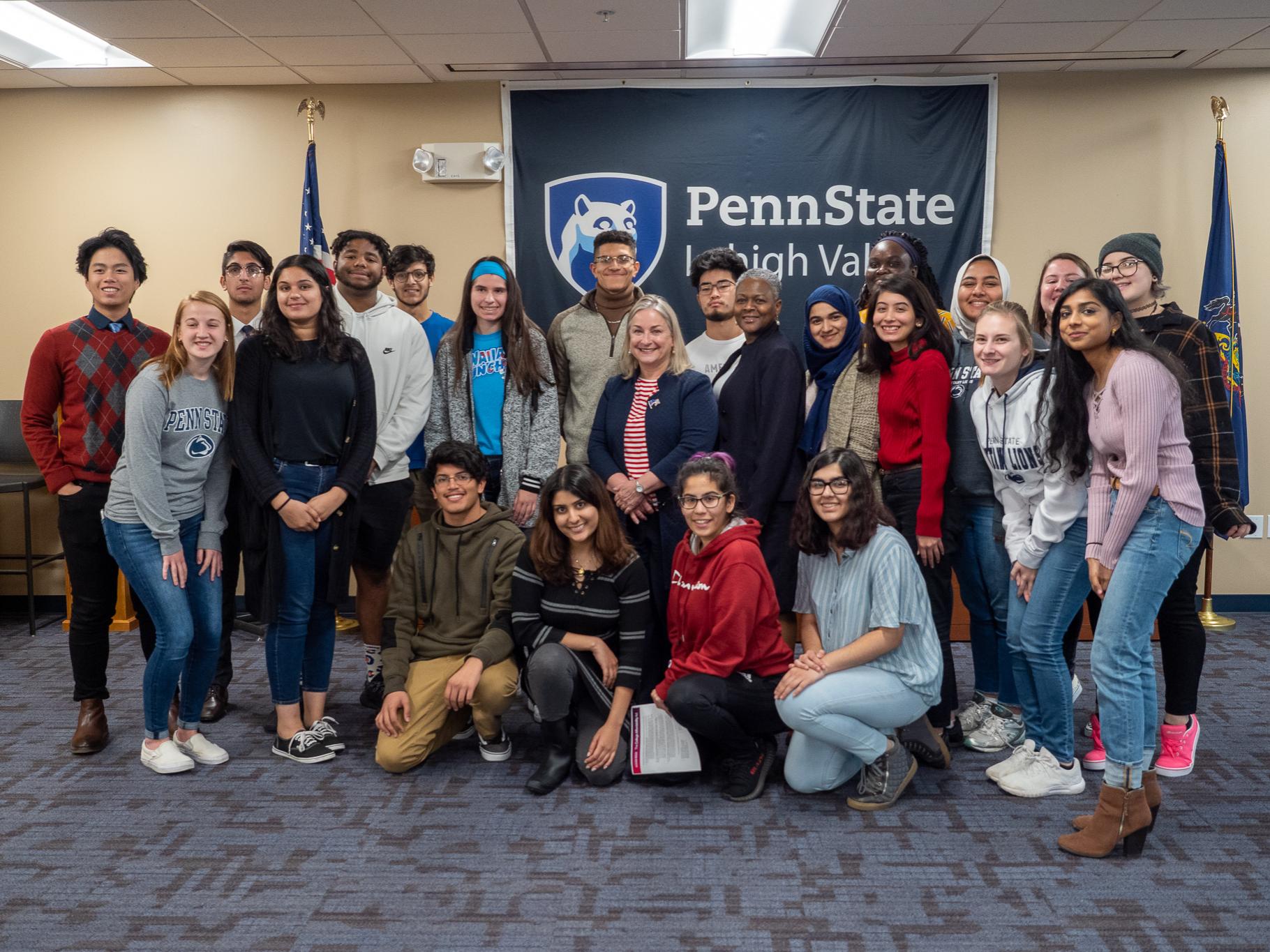 Congresswoman and chancellor posed with students