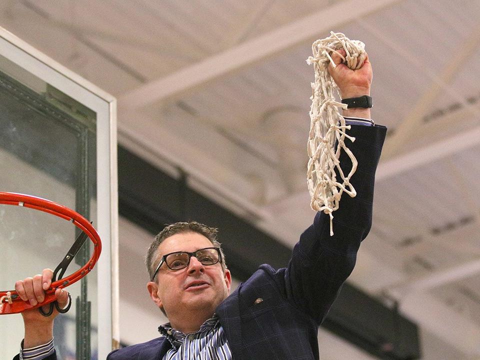Coach Don Friday holding net