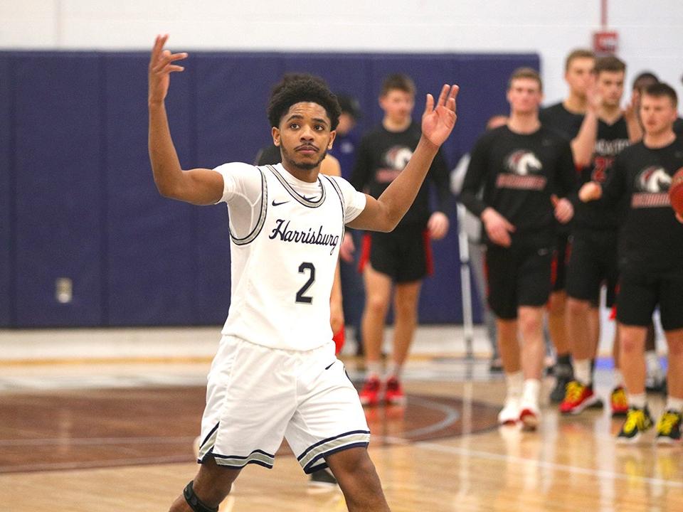basketball player with arms raised
