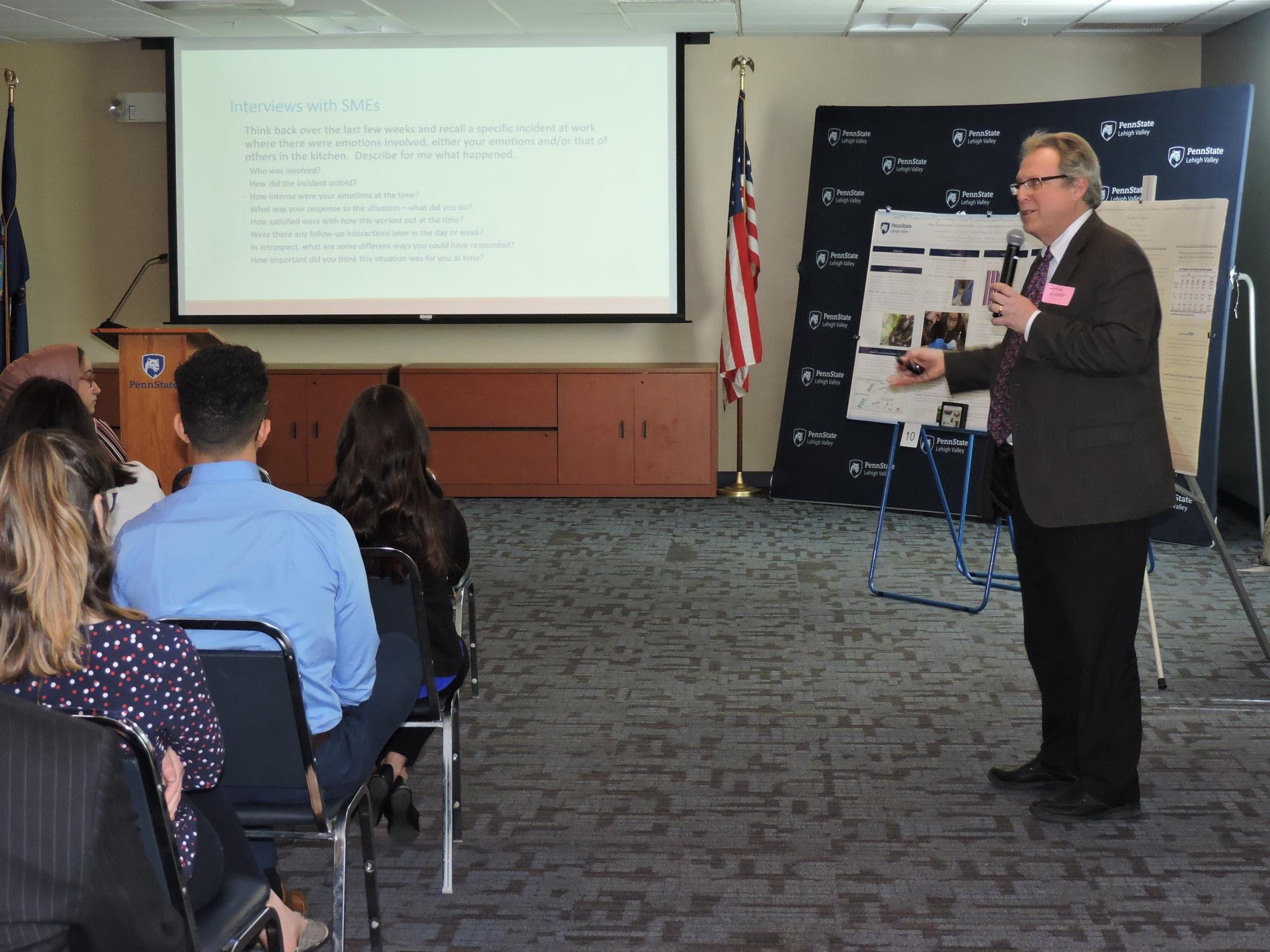professor presenting to group