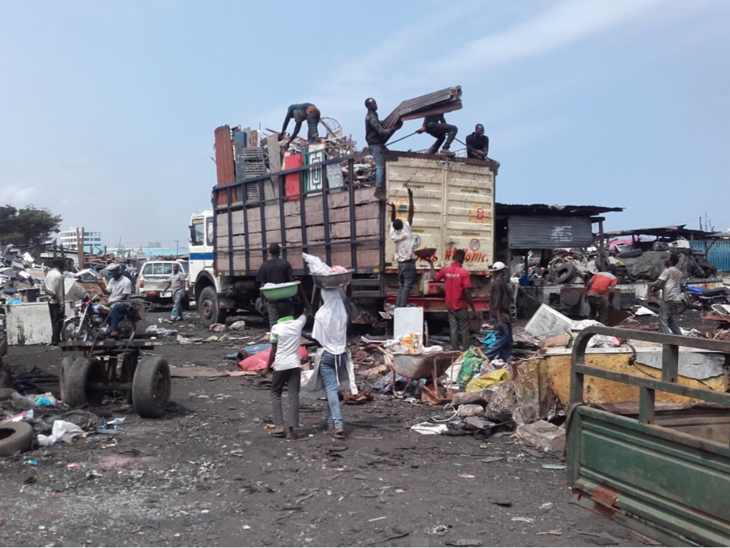 unloading truck in scrapyard
