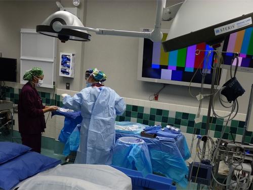 Nurses work together to prepare the OR for surgery 