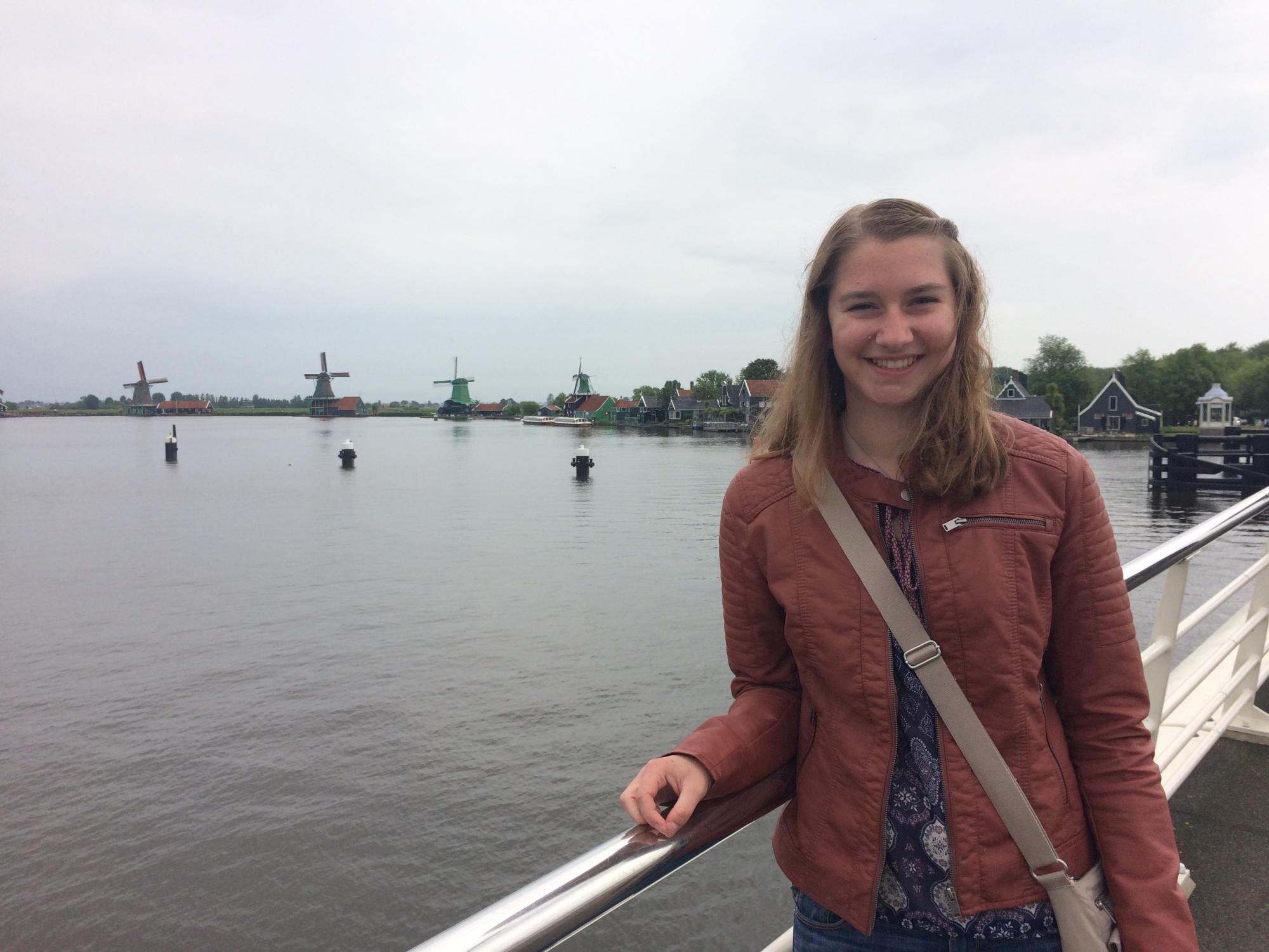 Erika Exton near windmills in The Netherlands