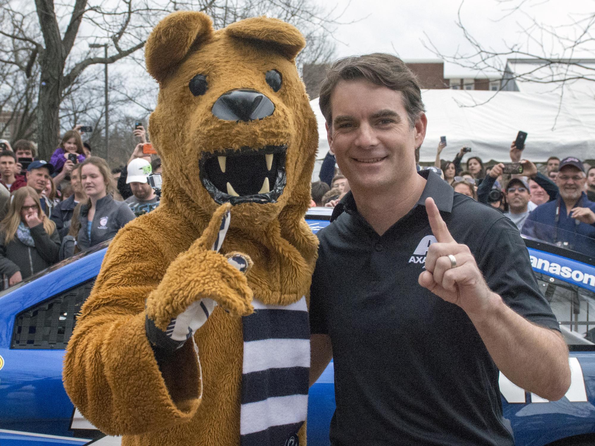 The Nittany Lion and Jeff Gordon pose in front of the No. 24 car.