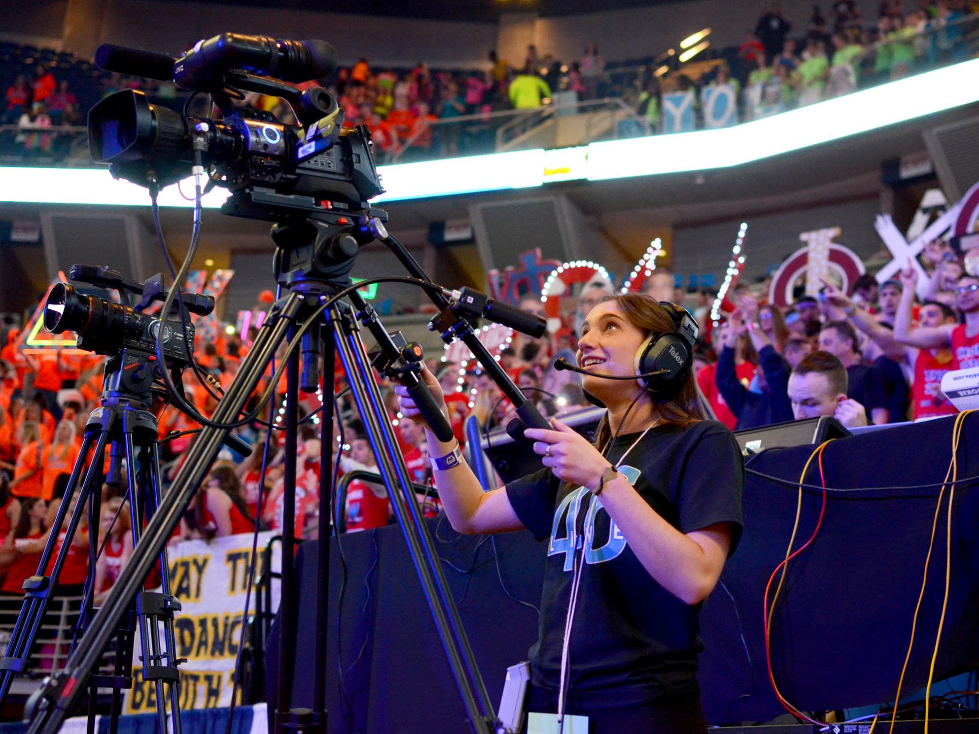 Student operating a video camera at THON