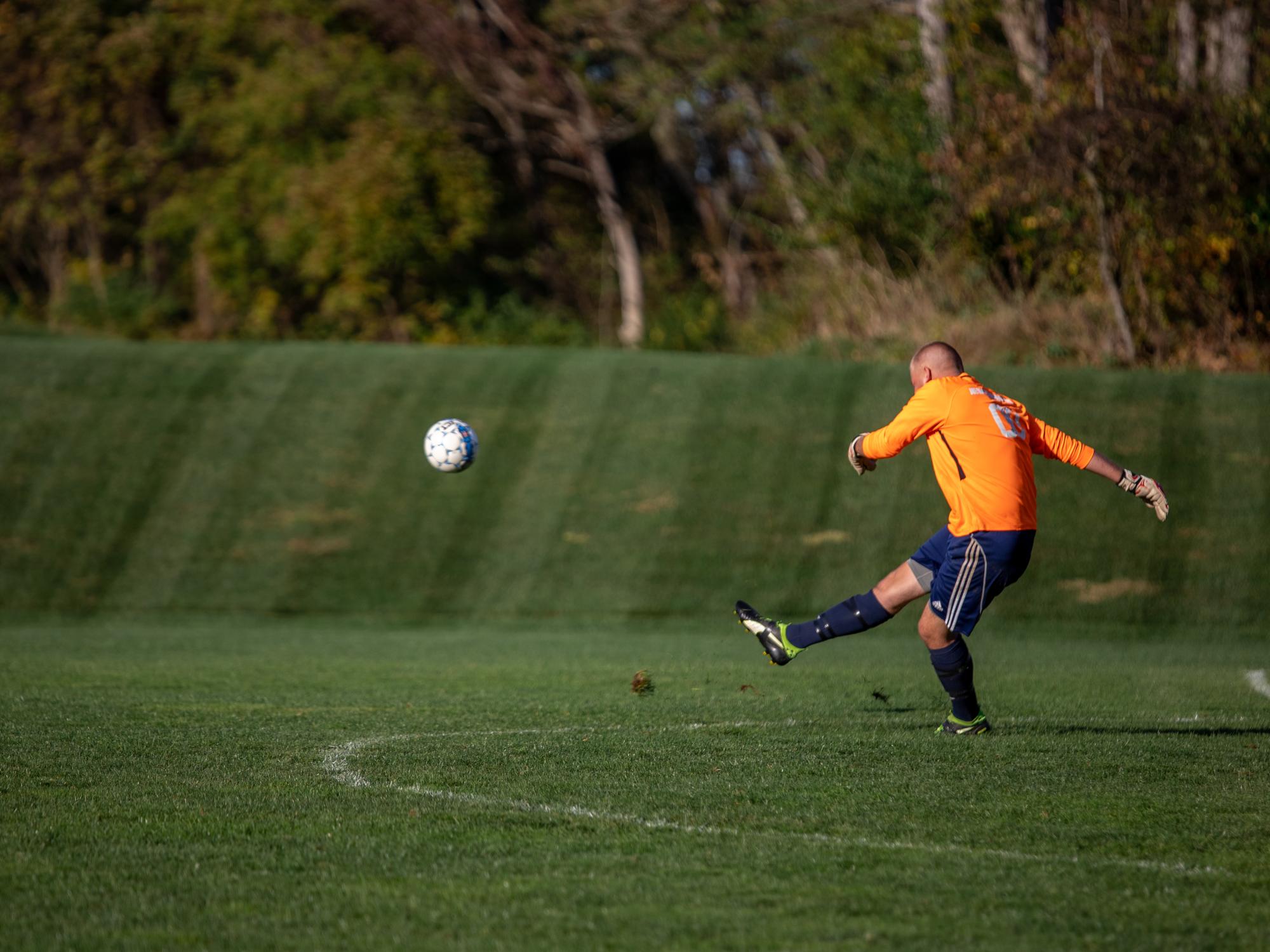Man kicks soccer ball