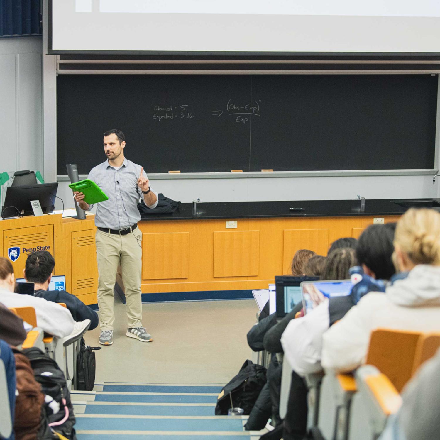 Matt Beckman lectures in front of many students